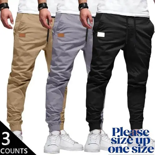 Men’s 3-Pack Casual Jogger Pants – Khaki. This pair has a low rise and slim fit. It runs small; we recommend ordering one size up. Available in Grey and Black. Features an elastic waistband with drawstring, ribbed cuffs, and PU patch detail. Made from lig
