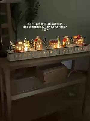 This wooden advent calendar isn’t just decor—it sings and turns every December day into a little family tradition. A cozy Christmas village keepsake you’ll bring out year after year ✨ #adventcalendar #christmastraditions #holidaymagic #christmas #christmasinjuly 