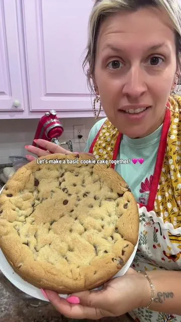 Let’s make a basic cookie cake together from scratch! Here’s the recipe i use!  2 sticks softened unsalted butter  3/4 cup sugar  1 cup light brown sugar packed  2 eggs 2tsps vanilla extract  1 tsp sea salt  2 tsps baking soda  4 cups all purpose flour  2 cups semi sweet chocolate chips  Cream softened butter, sugar, and brown sugar together in a kitchenaid stand mixer (or any Stand mixer!) or by hand. Add eggs and vanilla extract and mix until combined. Next add in sea salt, baking soda and flour. Mix this until just combined. Last add in your chocolate chips and mix until combined. Press into the bottom of a greased baking pan and place in a preheated oven (350 degrees) for 22 to 25 minutes! Decorate your liking! #cookie #cookiecake #fyp #baking #bakingrecipe @KitchenAid @Nestle Toll House 